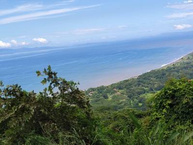 9,000 m² Lot in Costa Montaña with Ocean and Valley Views – Services Available